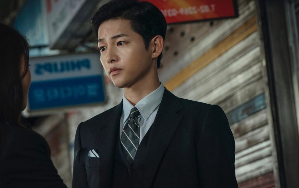 The main male actor from Vincenzo watching toward girl