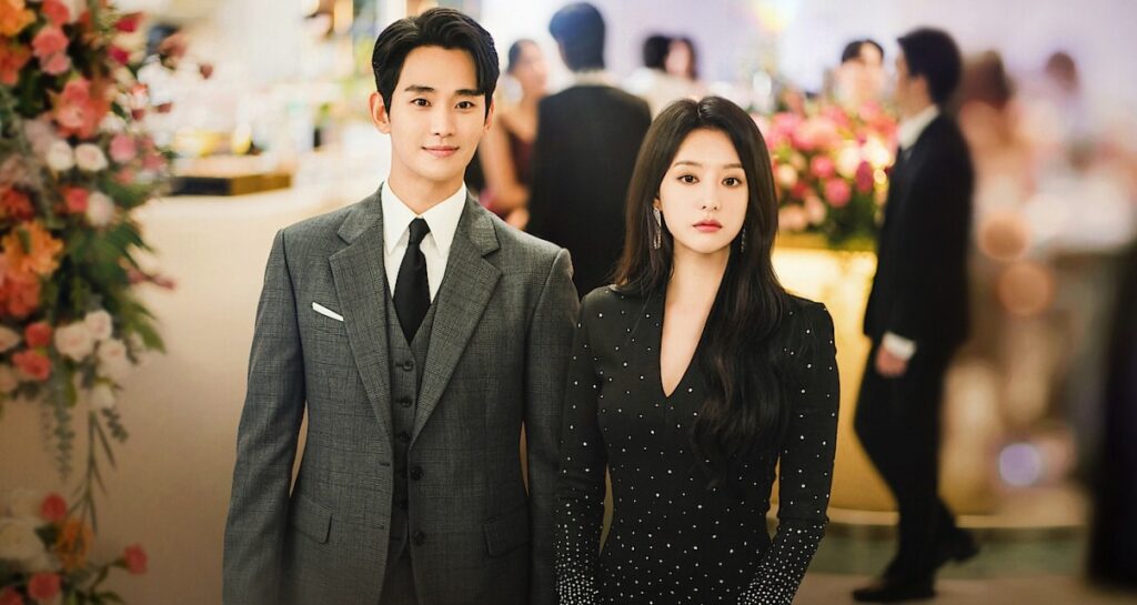The image of main couple of Queen of Tears holding each other hand
