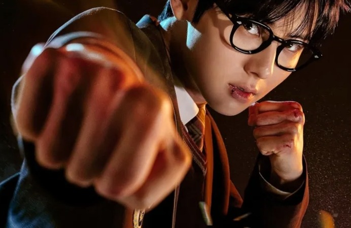The main lead Cha Eun-woo of Study Group is standing and poniting out boxing punch